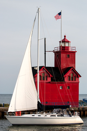Lighthouse and sailboat